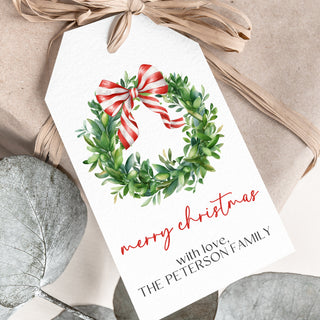 a christmas card with a wreath on it