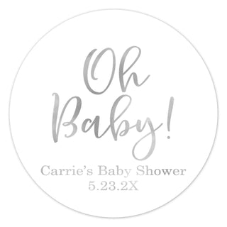 a round sticker with the words oh baby on it