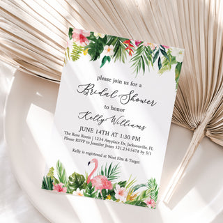 a white plate topped with a card next to a fan