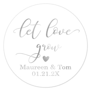 a round sticker with the words let love grow on it