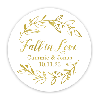 a white and gold wedding sticker with leaves