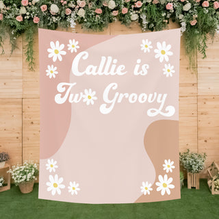 a pink and white banner with flowers on it