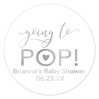 a round sticker with the words going to pop on it