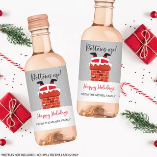 two bottles of wine with a holiday message on them