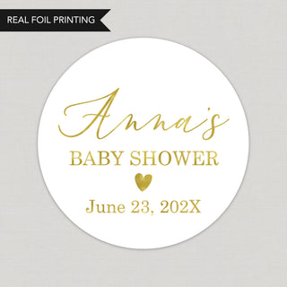 a baby shower sticker with a gold heart on it