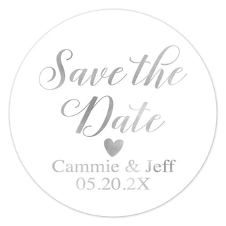 a round save the date sticker with a heart