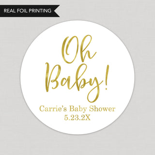 a round sticker with the words oh baby on it