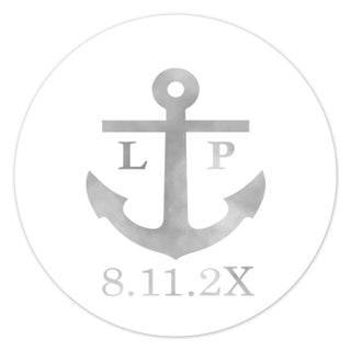 a round sticker with an anchor on it