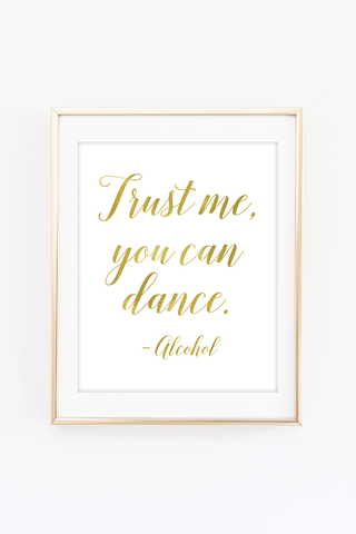 a gold foil print with the words trust me, you can dance