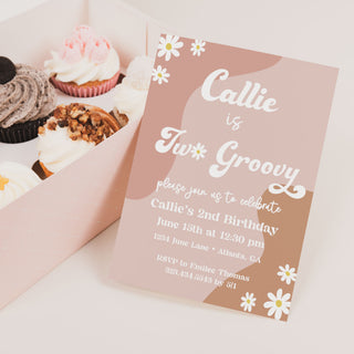 a box of cupcakes with a card inside