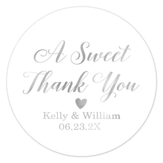 a white round sticker with the words, a sweet thank you and a heart