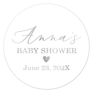 a round sticker with the words baby shower and a heart on it