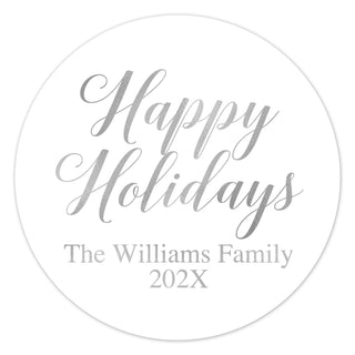 a white round christmas ornament with the words happy holidays on it