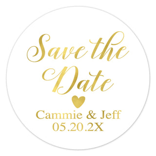 a round save the date sticker with a gold heart