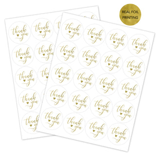 two gold foil stickers with thank you written on them