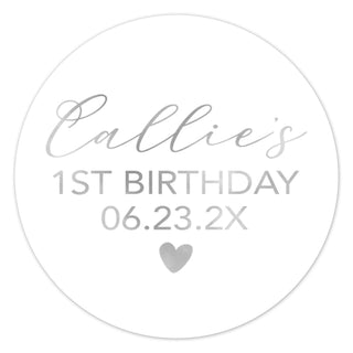 a round birthday sticker with a heart on it