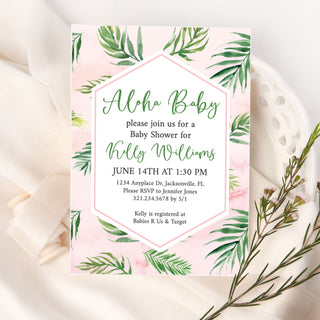 a pink and green baby shower with greenery