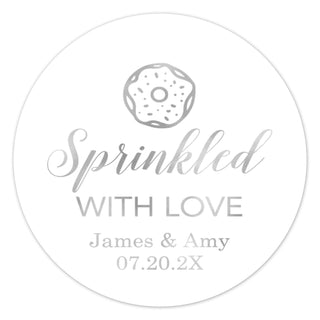 a round sticker with the words sprinkled with love and a donut