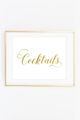a framed photograph of a gold lettering that reads cocktails