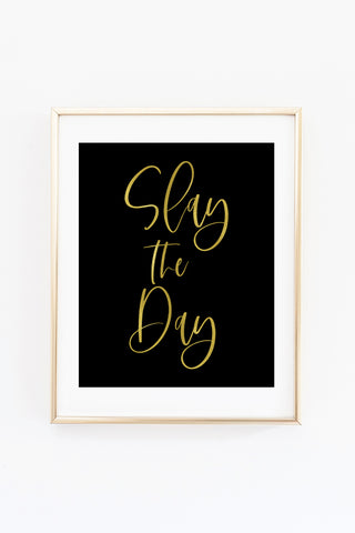 a black and gold print with the words slay the day