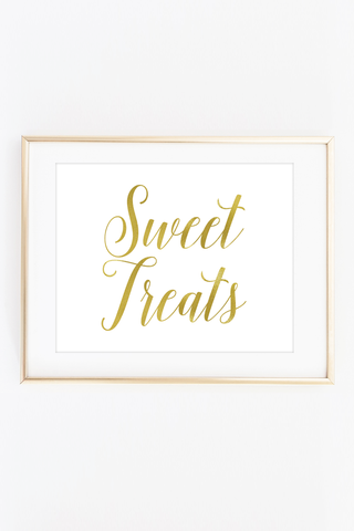 a framed print with the words sweet treats in gold foil