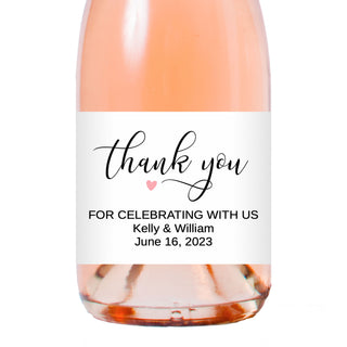 a bottle of wine with a thank you label on it